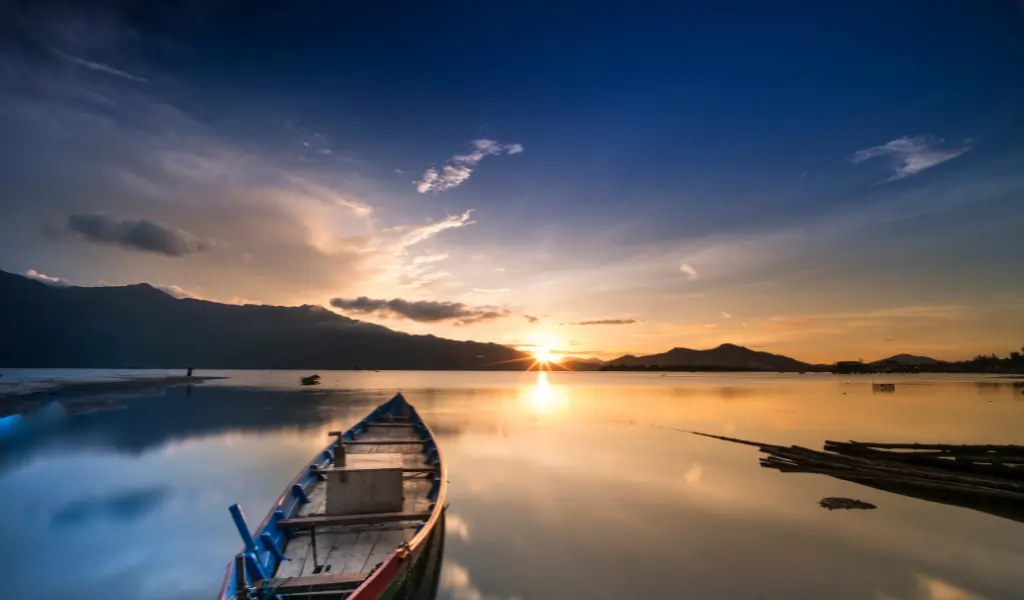 Canoe Boat With Sunset View